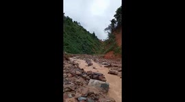 Flash floods caused hundreds of huge stones and trees to spill onto the road