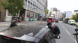 Car pushes protester at 'anti-vaccine passport' protest in London