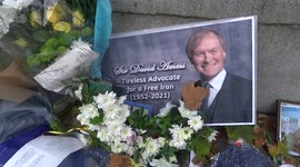 Floral tributes to Sir David Amess outside the Houses of  Parliament in London