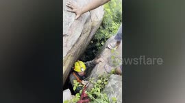 Dog trapped between rocks in hillside rescued in Thailand