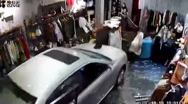 Car smashes into clothing shop as newbie motorist presses accelerator by mistake