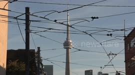 Spectacular orange sunset lights up the east west downtown Toronto streets as the angles into position for the annual autumn TorontoHenge phenomenon