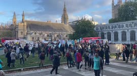 Pro-refugee protesters start rally in Parliament Square with minute of silence