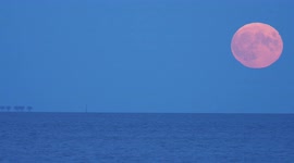 Hunter's Full Moon rising next to WW2 sea forts in Kent, UK