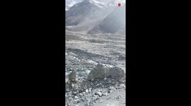 'Tourists awe-struck watching an ibex easily climb a mountain in Northern Pakistan'