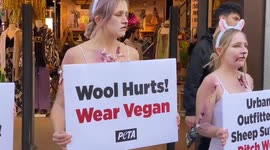 “Bloody” and “bruised” PETA supporters staged wool protest outside Urban Outfitters in Oxford Street