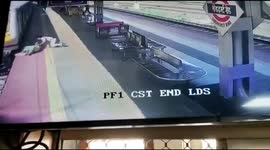 Railway security force constable saves elderly women who fell while boarding local train in Western India.