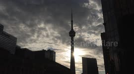 Toronto rush hour car and pedestrian traffic in the downtown financial and business district continues to build and more people return to in person work in the office towers.