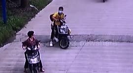 Chinese delivery driver throws stones at woman and her grandson after their scooters almost collide