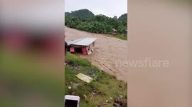House washed away by raging river after heavy rain in the Philippines
