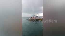 Waterspout appears over fishing boat in the Philippines