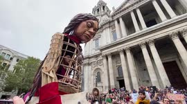 Hundreds pack streets to welcome Little Amal to St Paul's cathedral in London