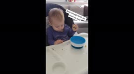 'I thought he finished!' Toddler caught stuffing food down side of chair