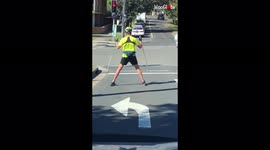 Motorist spots guy 'skiing' through streets of Sydney during summer