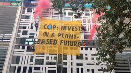 Climate activists scale Home Office building in London to call for 'plant-based future'