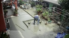Naughty dog walks all over freshly laid concrete in Thailand