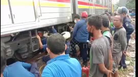 Trapped in traffic, one motorbike was hit by a train at Petamburan, Central Jakarta, Indonesia