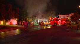 Firefighters battle to extinguish blaze burning through residential area in California