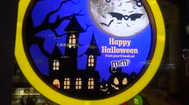 M&M advertising in Leicester Square wishing Londoners Happy Halloween and Happy Black History Month