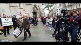 Supporters of Julian Assange gather outside Royal Courts of Justice ahead of extradition hearing