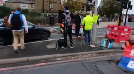Insulate Britain protestors covered in ink by motorists as they block London road