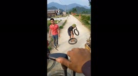 The men used old tires and wooden boards to move the excavator without damaging the road