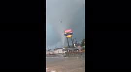 Shocking moment funnel cloud tornado cuts across Texas highway