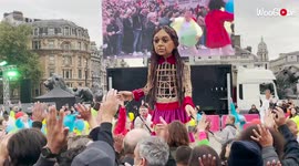 'LARGER-THAN-LIFE Syrian puppet enjoys her birthday party in Trafalgar Square'