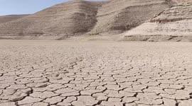 Dam turned desert as water dries up leaving barren landscape in Jordan