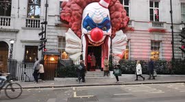 Giant clown face takes over entrance of private club in London