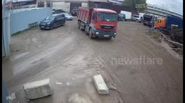 Russian woman manages to survive after being run OVER by huge dump truck