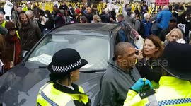Two women protest outside the Royal Courts of Justice by blocking road, alleging police corruption