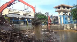 Garbage clogs up Jakarta sluice after heavy rain and flooding in Indonesia