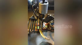 Street food chef with injured hand invents ROBOT arm to help him cook