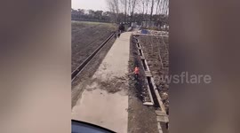 Pilot lends a hand to Chinese sanitary worker by using HELICOPTER to sweep leaves