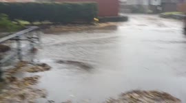 Video shows a flooded street in the Lake District after severe weather conditions