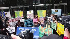 Climate activists protest against Standard Chartered Bank over fossil fuel investment