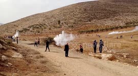 Palestinian protesters clash with Israeli forces during protest against Israeli settlements in Beit Dajan