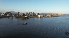 A boat is crossing the bay in Vitória city