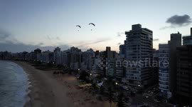 Those paratents are flown over the Praia da Costa beach in Vila Velha - Brazil