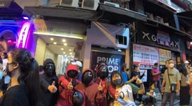 Family disguised as Squid Game guards in Lan Kwai Fong, Hong Kong, for Halloween