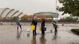 Climate activists stage dirty oil protest outside COP26 venue in Glasgow