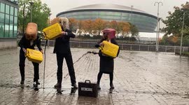 Ocean Rebellion's activists pour 75 litres of 'oil' outside COP26 venue