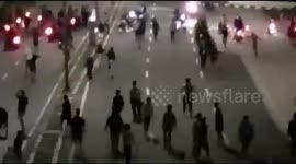 Explosion of violence as gangs on their motorbikes descend on Indonesian street with sharp weapons