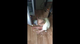 Mom turned away for 1 minute. A one-year-old baby opened the refrigerator, took out cottage cheese, smeared it on the floor and began to eat