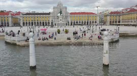Lisbon Commerce square flyover. Done footage flying above the main square in Lisboa. Rua Augusta street.