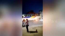 Passersby in China flag down flaming bus to allow students to evacuate vehicle