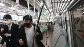 Tokyo train passengers desperately flee down carriages after man dressed as 'The Joker' injures 17