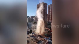 Column of hot water towers above road after heating pipe bursts in northern China