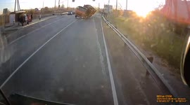 Dashcam captures terrifying moment truck rolls after running red light